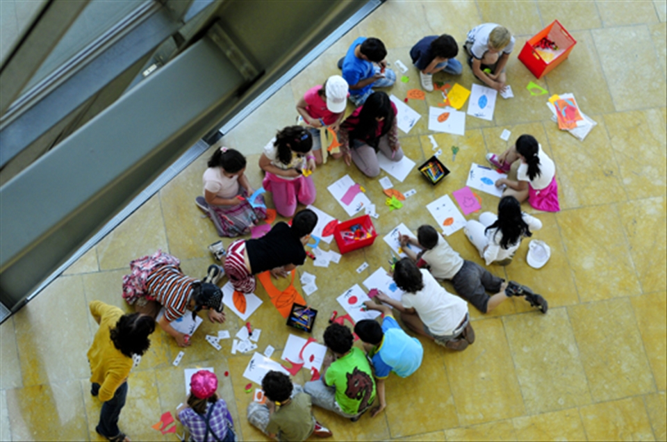 Children learning the essence of art in a building made of pure art