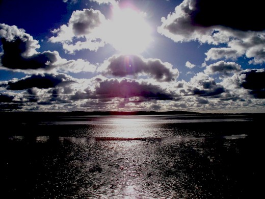 Summer sun, looking over Wales.