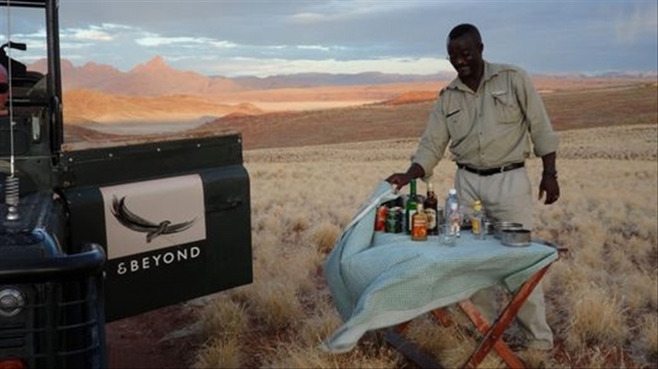 Just before sunset is known as Sundowners.  Standing on fossilised dunes watching a thunder storm cross the desert. Priceless.