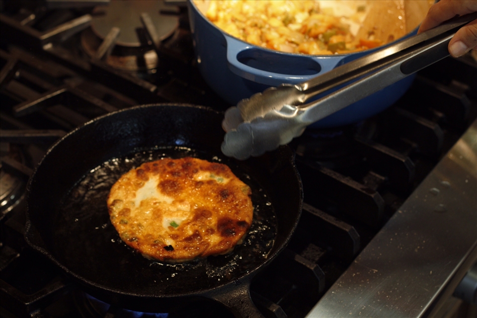 frying pancake as stew awaits
