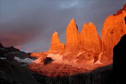 The rising sun spotlights Las Torres bringing warmth to the cold granite face.