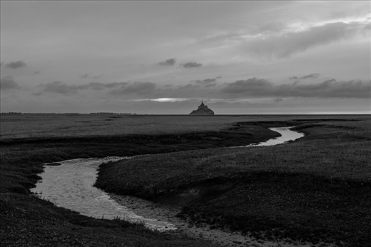 Mont Saint-Michel sits protected by tides, mud and quicksands.