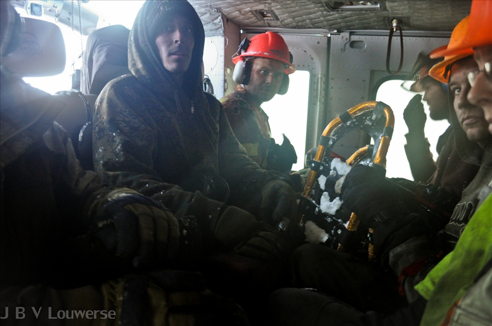 A pine beetle control crew is evacuated by helicopter ahead of northern-winter storm front. Once a storm hits, the density of the snow falling from the sky would make flying an impossibility for the pilot and any crews not picked up in time would be left in the wilderness until the weather improved. For workers in this environment, the potential for having to overnight in the wilderness during a storm is something that is always at the back of the mind every morning when they get flown into the area they will be working. On this occasion, the helicopter was unable to pick up two workers due to the rapid approach of the storm. They survived the night by building a shelter and a fire.