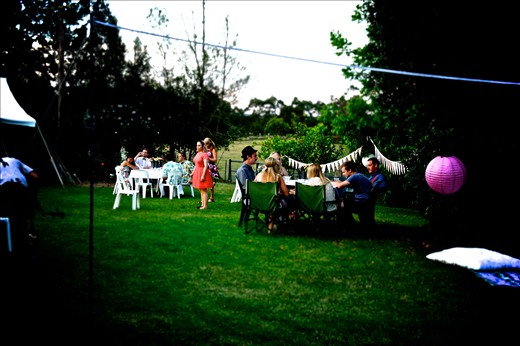 The scene of the soiree. People gathering among the decorations.