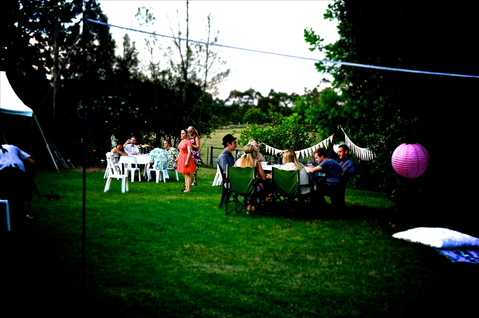 The scene of the soiree. People gathering among the decorations.