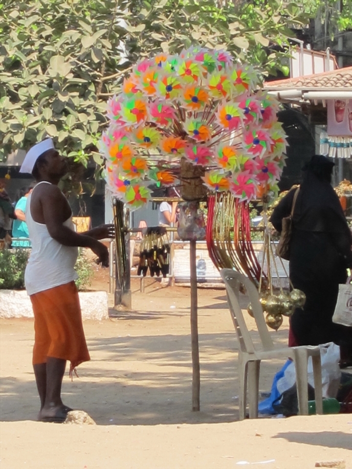 The hawkers comprise a small section of slum-dwellers that supports the survival of the city’s other poor by keeping essential commodities cheap and affordable. The children’s toys at this Muslim vendor’s stall sell for about 10 cents each, but business is slow until sundown. Most of the goods are handmade in the mega-slums of Mumbai and sold directly to vendors, thereby cutting out the expensive middlemen. 