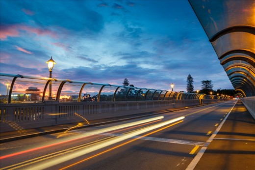 This is the Grafton Bridge during sunset. Grafton Bridge spans Grafton Gully, joining Karangahape Road on the city side and Park Road en route to the Domain and Auckland Hospital on the other.