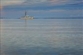 Was walking along the shore of Cornwallis  Beach New Zealand, during sunset and snap this boat alone in the sea and the sky makes a beautiful colour in the sea.: by benz, Views[471]