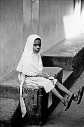 My father may have gone, but I can still walk in his shoes. Aala waits every day after school in a side street in Stone Town for her father to return from the mainland, where he went looking for work 6 months ago. There has been no word from him since.: by bernadettemccabe, Views[184]