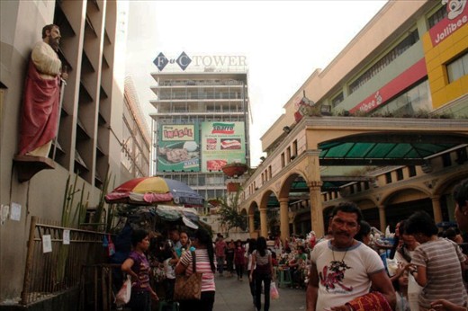 Businesses surround the church here in Quiapo, Manila. 