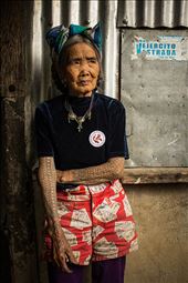 Fang-Od shows her tattoo that was given to her when she was young. Some say it was her father who tattooed her, while others say it was given by another Kalinga tattoo artist. She has become a culture bearer. Her inked skin is a living artifact that speaks stories of her tribe’s culture and history. : by bernicebeltran, Views[744]