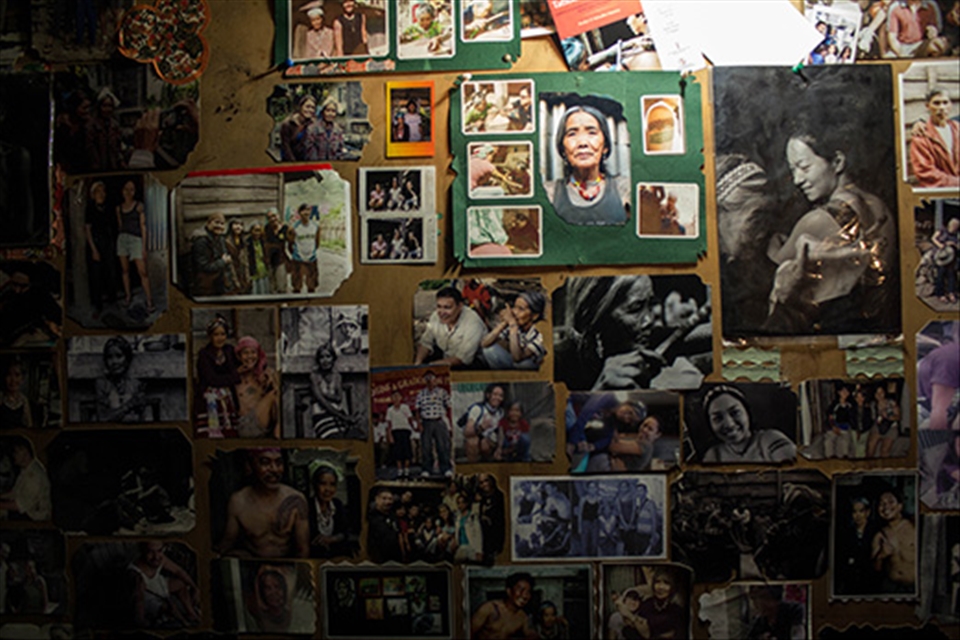 Fang-Od lets customers stay as guests in her home. I found this wall inside her house where she pinned all of her photographs, including the ones sent by her former traveler customers as gestures of gratitude for their tattoos.