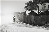 Since the majority of the city was heavily damaged from the quake, settlements popped up further and further away from the city. A Haitian women walks by a clinic built about an hour outside Port Au Prince.: by beyoustill, Views[243]