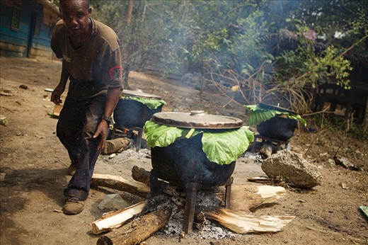 With more than 250 mouths to feed at the sanctuary, food preparation is a vital and constant task. Here Romaine, one of the gorilla keepers, prepares a favourite - sweet potatoes - for the animals.