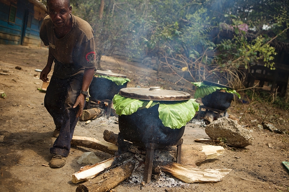 With more than 250 mouths to feed at the sanctuary, food preparation is a vital and constant task. Here Romaine, one of the gorilla keepers, prepares a favourite - sweet potatoes - for the animals.