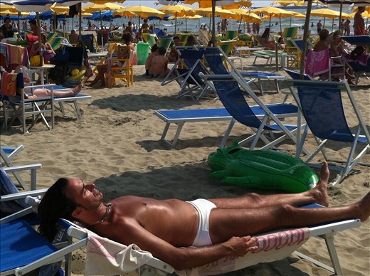 My partner Cathy took this picture of a sexy guy wearing a skimpy white bikini. We found out it was quite see thru when wet haha.