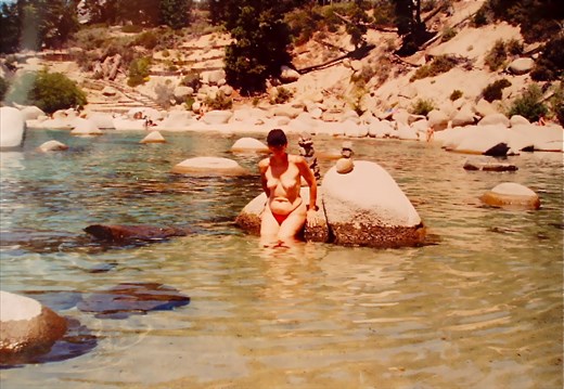 Cathy topless next to a strange rock formation. Does anyone know what it meant?