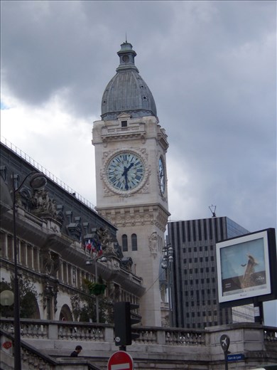 Paris -- clock tower at Gare Lyon -- lit up at night -- visible from apartment