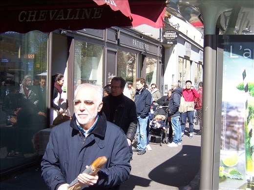 Paris -- Marche Jeanne d'Arc -- bread being  sold out of a boulangerie window 