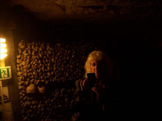 Paris -- Catacombs -- Cindy in front of a bone pile