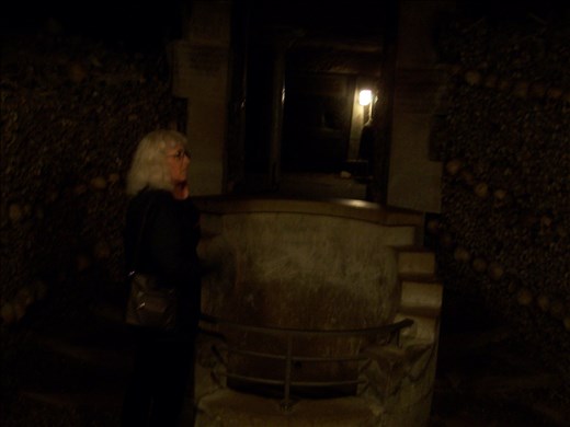 Paris -- Catacombs -- Cindy in front of a fountain where bone stackers washed-up