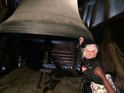 Paris -- Cathedrale Notre Dame -- touching one of the bells.01