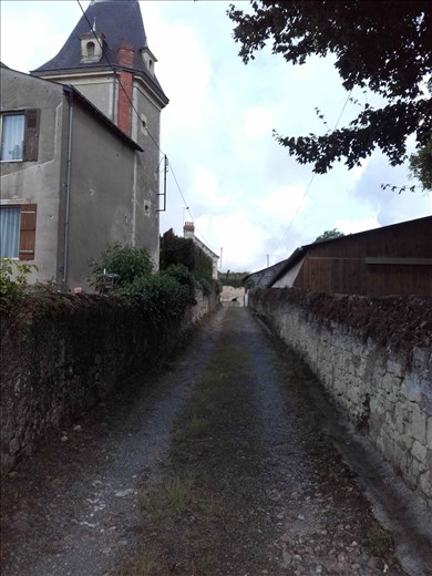 Coutures -- lane next to house