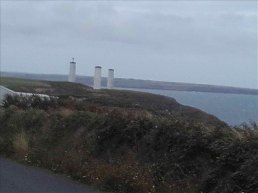 Southern Ireland Coast -- Bunmahon -- lighthouses -- sculpture on left lighhouse