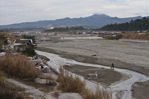 A lahar-filled river,  almost 21 years after Mt Pinatubo’s devastating eruption in 1991.  Small volcanic stones continually flow with the river waters and serve as source of living for nearby residents.