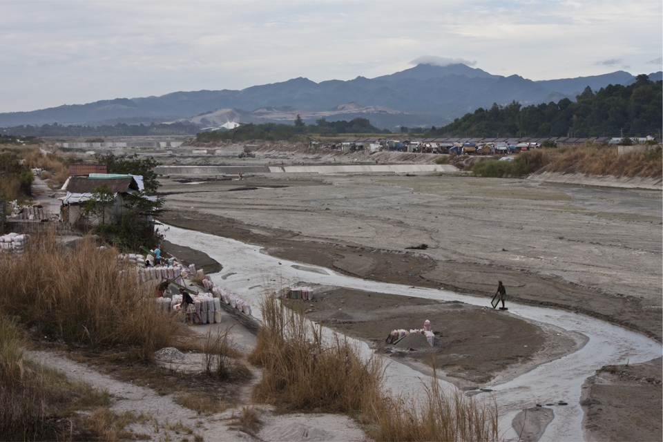 A lahar-filled river,  almost 21 years after Mt Pinatubo’s devastating eruption in 1991.  Small volcanic stones continually flow with the river waters and serve as source of living for nearby residents.