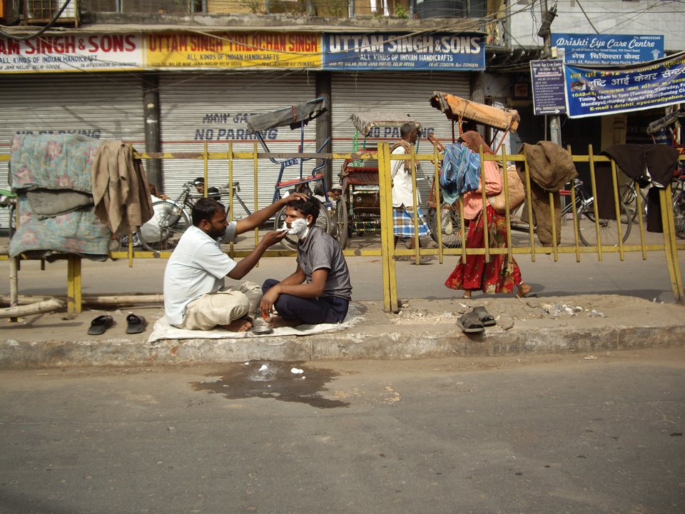 A white hessian sack lays the foundation of a barber shop.