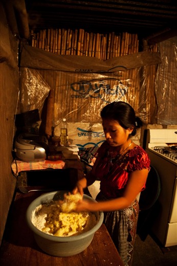 Baking bread for the tourist trade helps Veronica support her family. Awaking at 3am every morning she prepares, bakes and packages the bread. It is the only form of income for a family of six to survive.