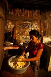 Baking bread for the tourist trade helps Veronica support her family. Awaking at 3am every morning she prepares, bakes and packages the bread. It is the only form of income for a family of six to survive.: by blackmamba, Views[372]