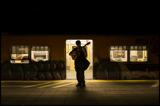 I was following him and documenting while he kept talking and telling stories. We were passing by this parked train and suddenly he stood still. Played some notes and I saw it... it was me. We were us. I saw myself, hidden in him. I asked him to move a few inches and got his whole figure framed in the back light of the train. 