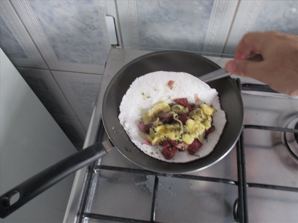 tapioca with dried meat, cheese and oregano