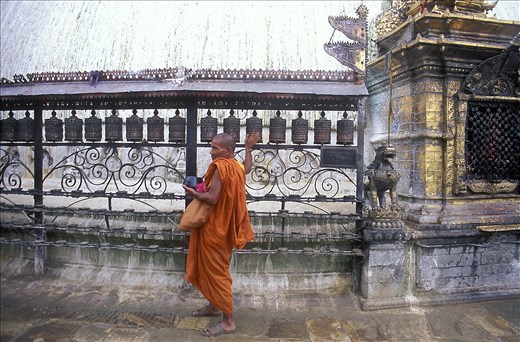 Monk spinning prayer wheels, Swayambunath Temple, Kathmandu