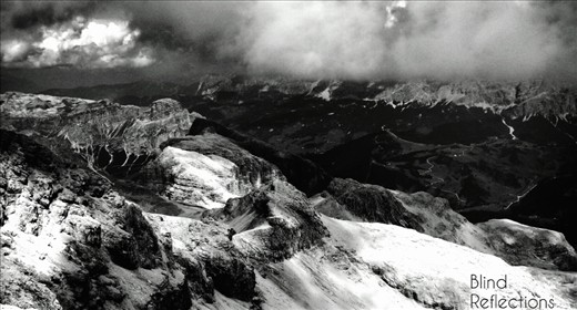 A storm approaches - Rain clouds form above Piz Boè and the valley below.