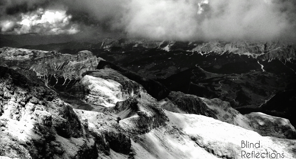 A storm approaches - Rain clouds form above Piz Boè and the valley below.