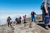 Trekking along the south side of mountain while moving from Karanga Valley up to Barafu Hut.  Now well above 4000m, the clouds are below us and we see sunshine for the first time in four days.  : by bmckamey, Views[1445]