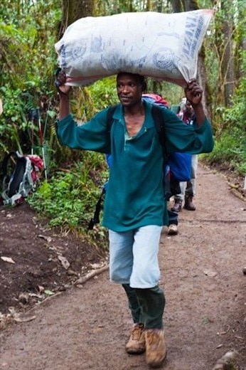 The porters on Kilimanjaro are similar to Nepal's famous sherpas.  Working as a porter is dangerous, but highly desirable because of the relatively high wages.