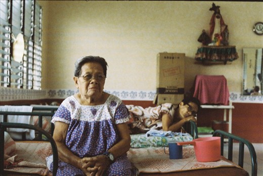 Precy and Judy are two residents who both have trouble speaking. Precy communicates through unintelligible grunts but gestures with her hands and eyes. You can tell she is joking when her grunt is followed by laughter and a smirk. Judy is a former stroke victim whose hands reach out to grasp words that seem to have escaped her. Though they cannot keep up with the banter of the other women, they both like to station themselves in the middle of things-sharing their thoughts with anyone patient enough to listen.

