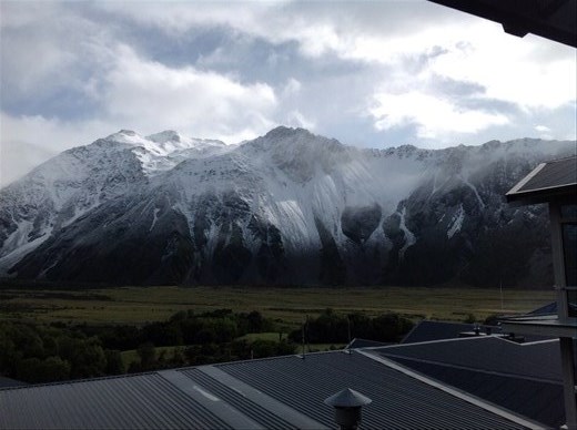 Mount Cook is hiding behind the snow and fog of the clouds.