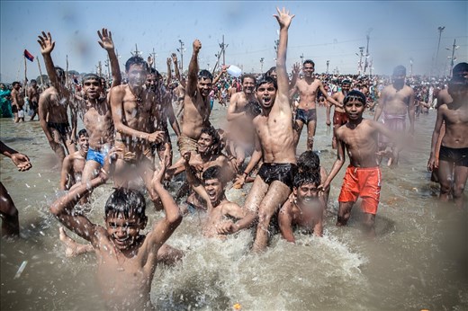 Group of boys enjoy bathe in Ganges. Over 100 million pilgrims gathered to take a dip in the holy river.