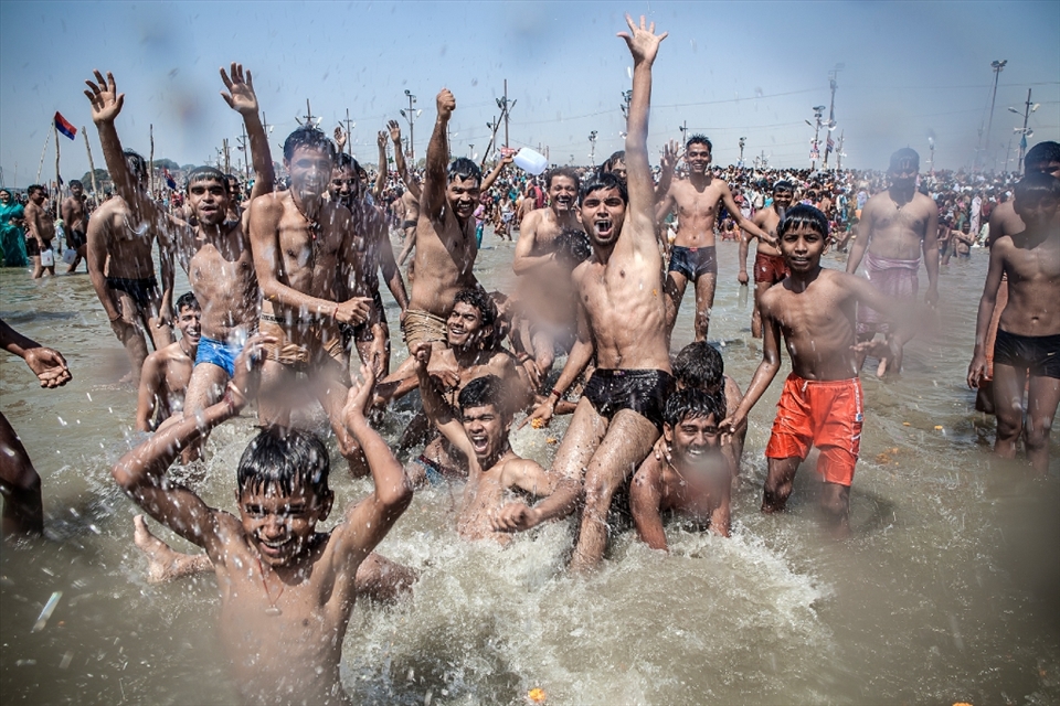 Group of boys enjoy bathe in Ganges. Over 100 million pilgrims gathered to take a dip in the holy river.
