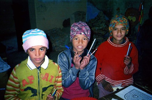 Kuru, Karishima & Kiran (Class6) with new beanies and pencils. This was the first year that the library extended teaching to Class 6 (though this did come about  after much pleading from the class!!).
