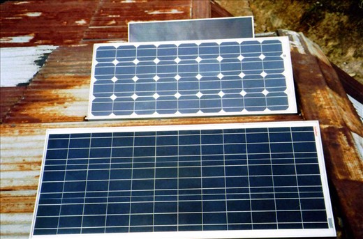 peAk solar array. In the foreground is a new 75w panel that now enables us to charge the two new computers and use the printer  & laminator.