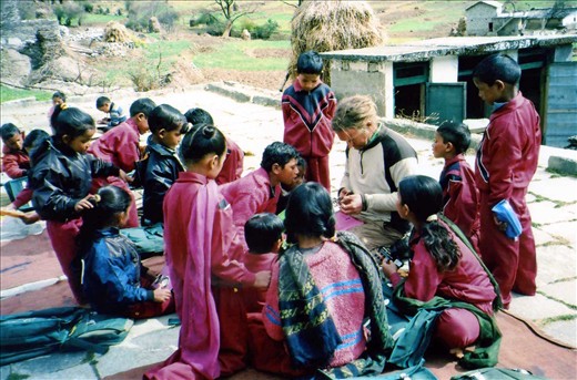 This photo of Scott helping out with nametags on pencil cases was taken post handing out school goodies.