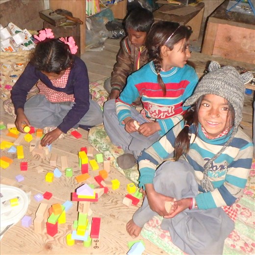 Bublee (Class one) giving me a brilliant smile! The kids are playing with a bucket of wooden blocks and manage to come up with the best building creations you can imagine.