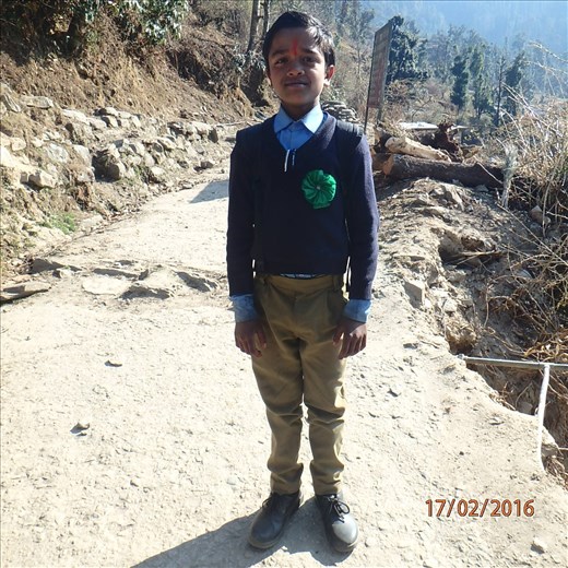 Vinod (Class 6) is one of the brightest students in class. Here he is on a sunny winters day striking a proud pose on his way to the library