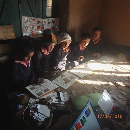 Class 5 boys playing a letter/word game. They absolutely love the idea and here they are engrossed in letters of the English alphabet